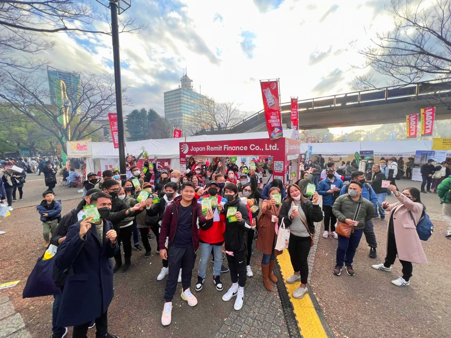 a crowd of people holding their cards